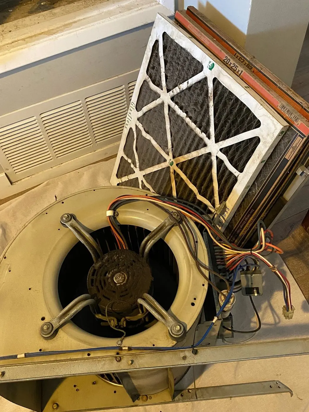 Blower assembly and filter removed from a package unit during maintenance