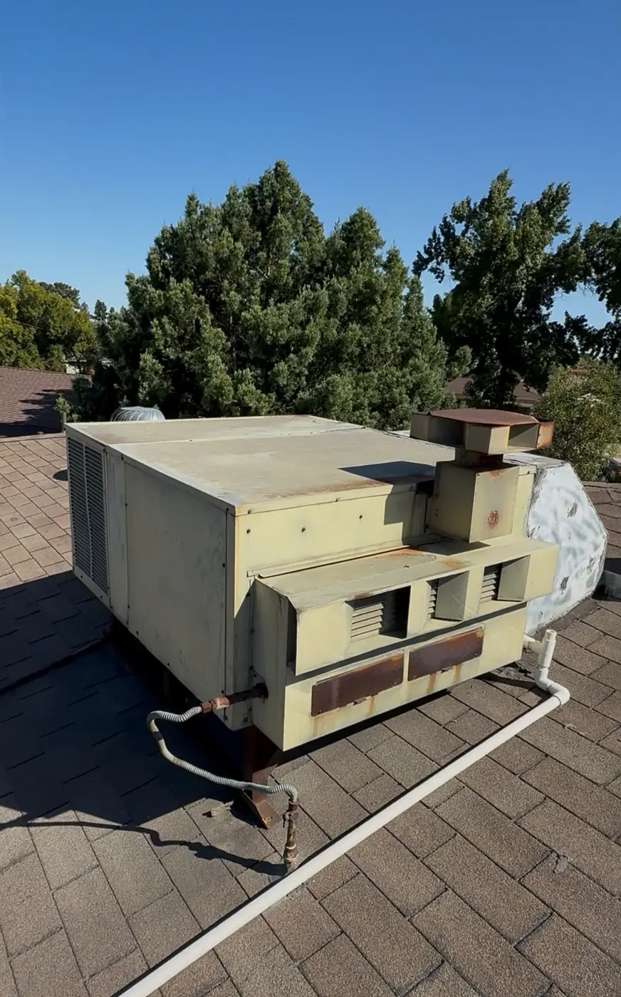 Older packaged rooftop unit with a weathered cabinet awaiting replacement