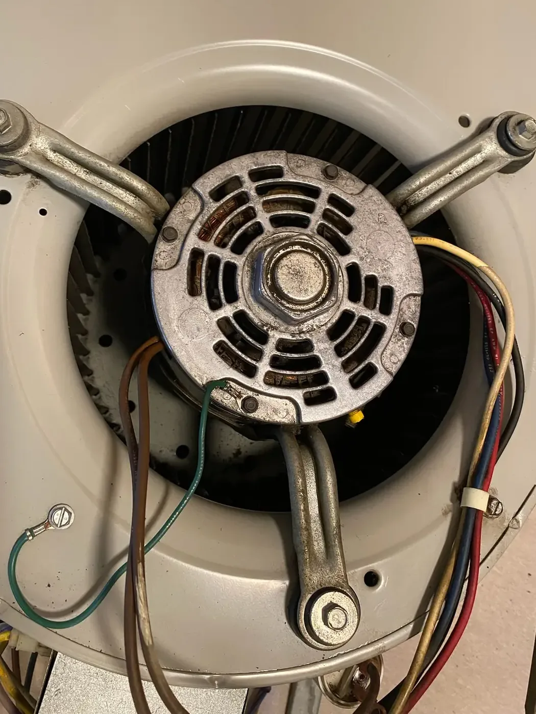 The same blower motor and wheel cleaned and reinstalled