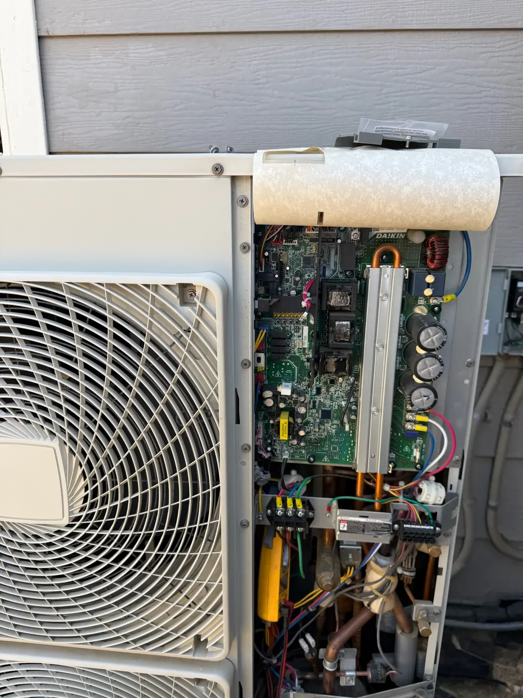 Control board and wiring exposed on the outdoor unit of a ductless mini-split system