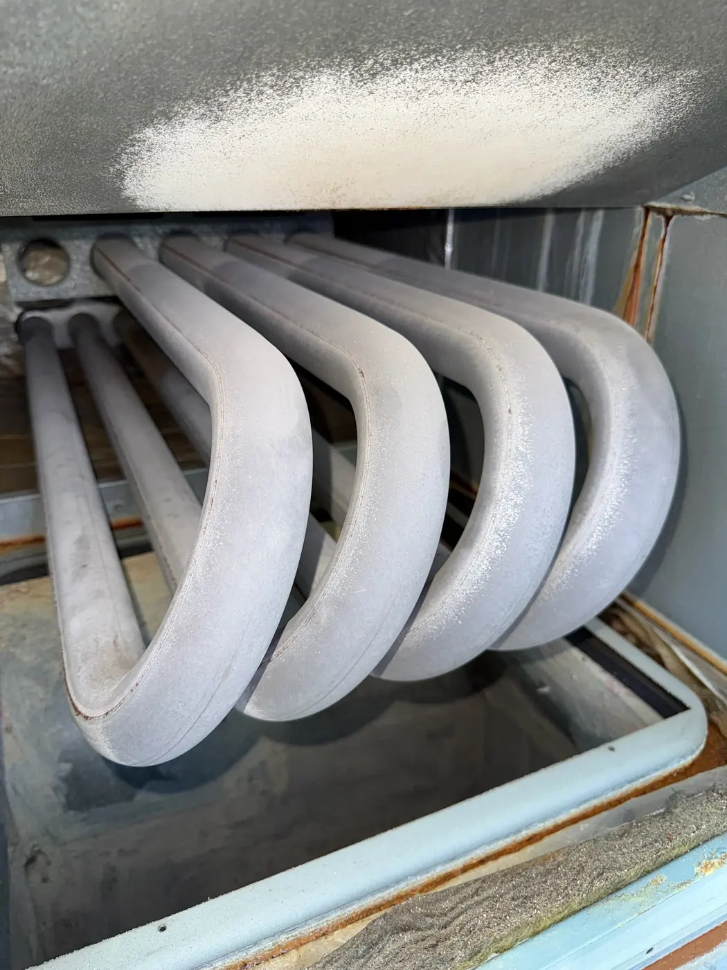Evaporator coil iced over inside an air handler cabinet